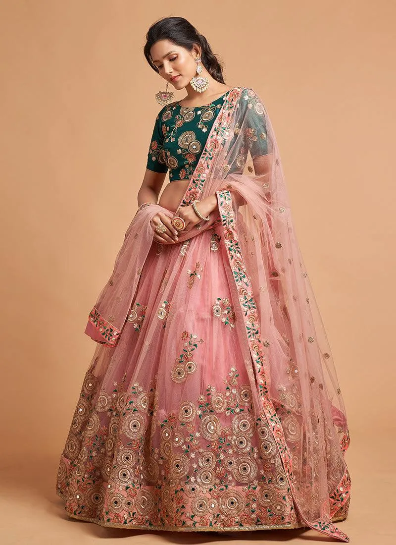 Soft Net Base Peach Color Embroidered Lehenga Choli With Contrast Blouse