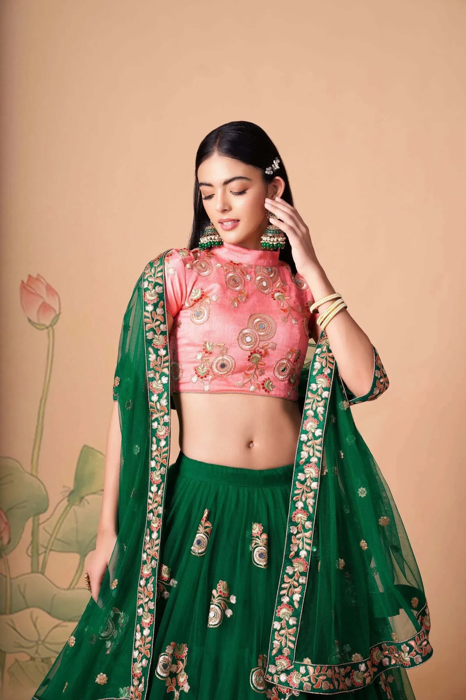 Soft Net Base Peach Color Embroidered Lehenga Choli With Contrast Blouse